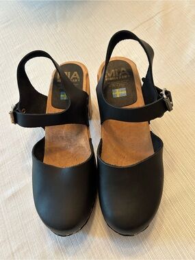 MIA Black Leather Ankle-Strap Clogs